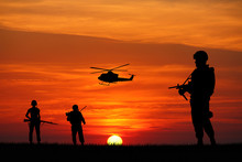 Soldiers Silhouette At Sunset