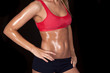 © Poulsons Photography - woman body sweat red sports bra on black