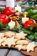 Sticker - Homemade biscuits in star shape on wooden table in christmas eve