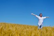 © .shock - young woman with spreading arms to sky