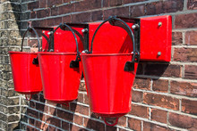 Three Red Fire Buckets Wall Mounted