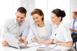© Syda Productions - business team having discussion in office