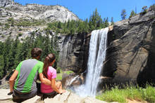 Hikers Couple Resting In Yosemite Park - Waterfall