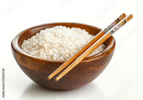 Fotografie, Obraz Wooden bowl with rice and Chinese chopsticks