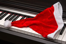 Piano Key With Santa Hat On A White Background.