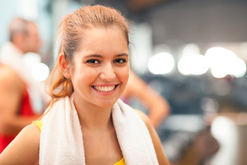 Wall Mural - Girl smiling in a fitness club