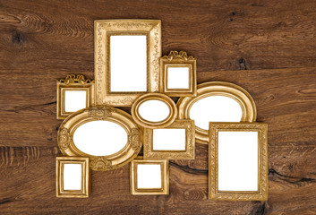 Wall Mural - antique golden framework over rustic wooden wall