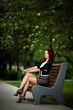 © Aliaksei Lasevich - young beautiful girl sitting on bench