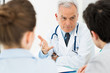 © Rido - Doctor discussing with patients
