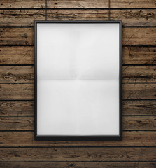 Wall Mural - blank frame on a wood wall