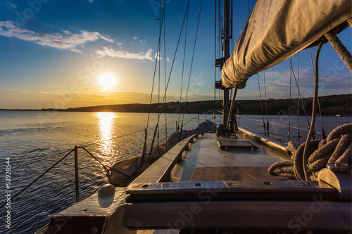 Fototapeta na wymiar sunset at sea on aboard Yacht Sailing