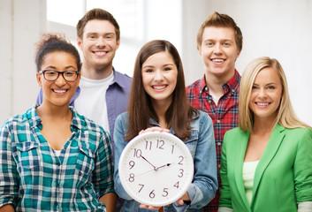 group of students at school with clock