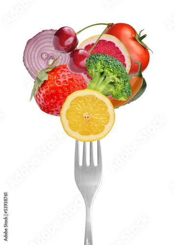 Fototapeta do kuchni Vegetables and fruits on forks. Isolated on white