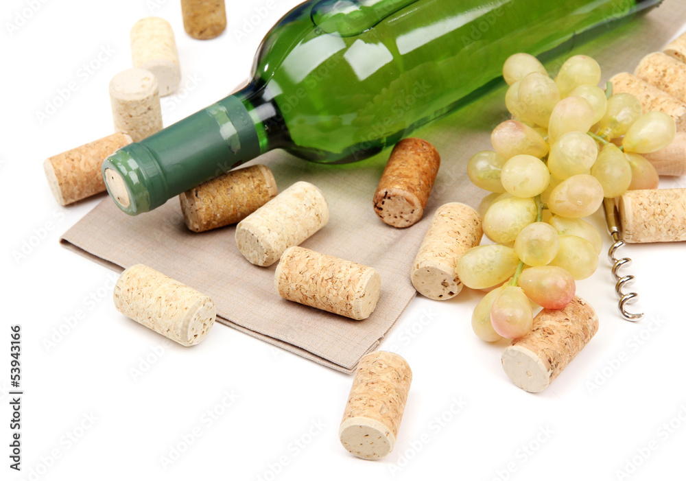 Bottle of wine, grapes and corks, isolated on white