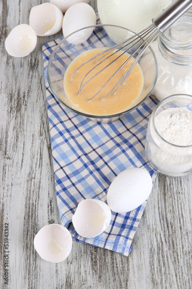 Ingredients for dough on wooden table close-up