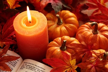 Wall Mural - Open Bible, candle, and autumn decorations.