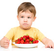 © Serhiy Kobyakov - Little boy refuses to eat strawberries