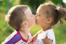 Little Boy And Girl Kissing