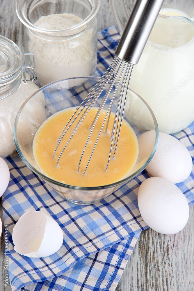 Ingredients for dough on wooden table close-up