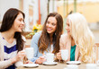 © Syda Productions - beautiful girls drinking coffee in cafe