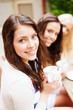© Syda Productions - beautiful girls drinking coffee in cafe