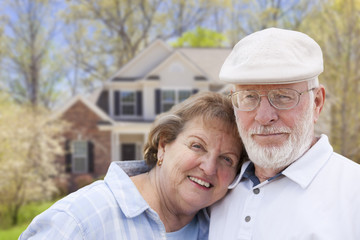 Wall Mural - Happy Senior Couple in Front of House