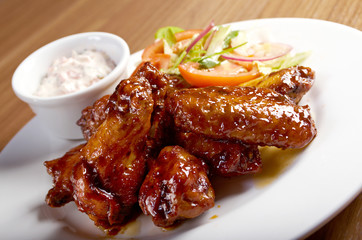 Wall Mural - Roasted chicken wings on plate