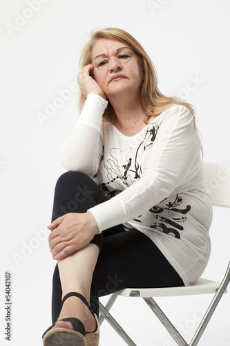 Fotografie, Obraz senior woman portait sitting with serious expression