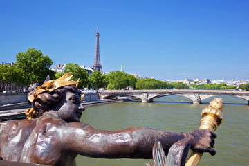 Wall Mural - Eiffel Tower, artistic statue and bridge on Seine river Paris, F