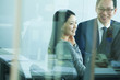 © xixinxing - Colleagues Meeting in Conference Room, Shot Through Glass