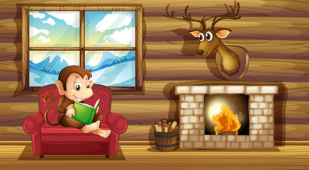 Aufkleber - A monkey reading at the chair near the fireplace