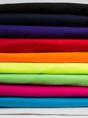 Colorful stack of clean t-shirts