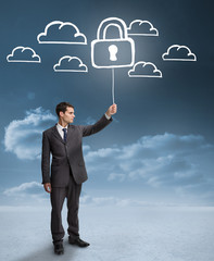 Poster - Businessman holding a floating padlock around clouds