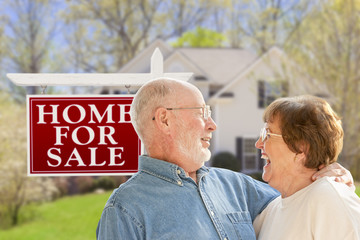 Wall Mural - Happy Senior Couple Front of For Sale Sign and House