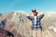 © william87 - Young Man with Binocular at Mountain