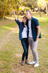 Wall Mural - happy teenage couple in forest