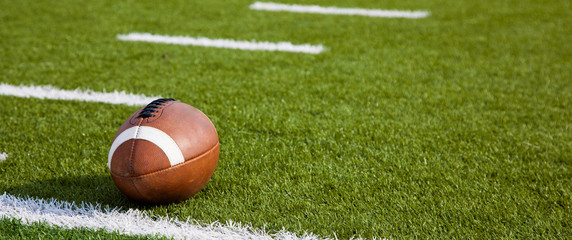 An American football on field