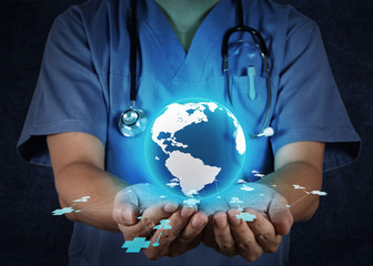 Medical Doctor holding a world globe in his hands as medical net