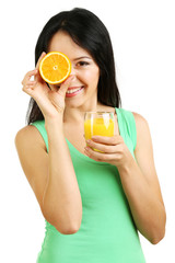 Wall Mural - Girl with fresh juice and orange isolated on white