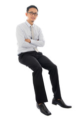 Poster - Asian businessman sitting on a transparent block