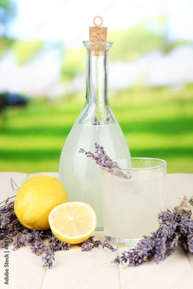 Lavender lemonade in bottle, on bright background