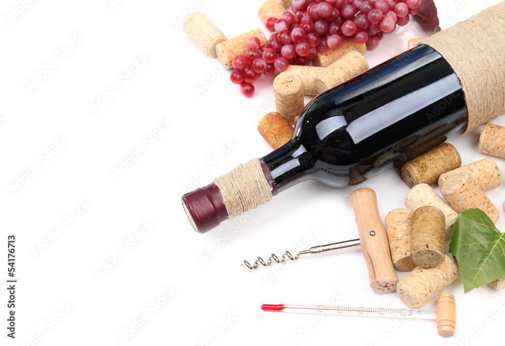 Bottle of wine, grapes and corks, isolated on white