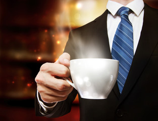 Business Man Holding a Cup of Coffee