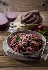 Poster - risotto with red wine and sausage, selective focus