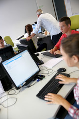 Group of young people in computer's lab