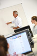 © goodluz - Business school teacher doing lecture on whiteboard
