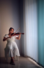Girl Playing Violin At Home Studio