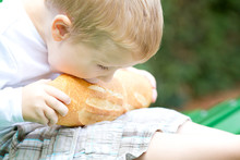 Three Years Old Boy Eating Bread