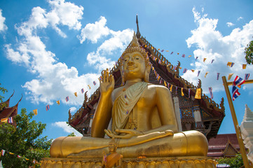 Wall Mural - big buddha gold color in temple at Thailand