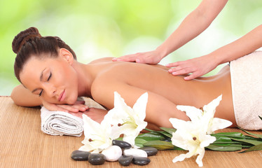 beautiful woman enjoying a massage therapy